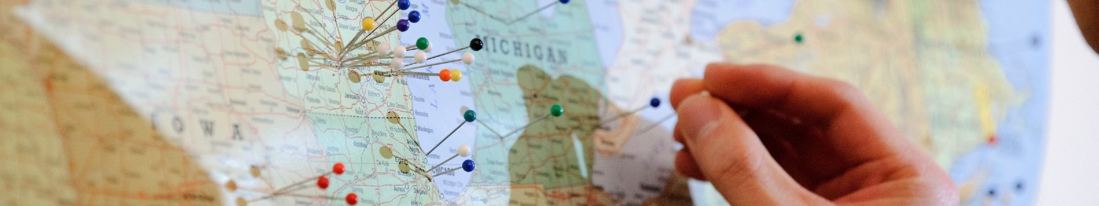 hand pinning a map